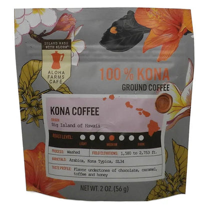 A 2 oz stand-up pouch of Kona Coffee from Aloha Farms Cafe, featuring a gray background decorated with orange and yellow tropical flowers and a central white label with coffee details.